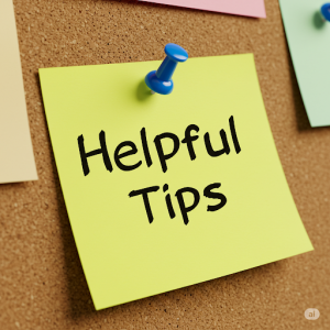 Yellow Post It Note on bulletin board with message - Helpful Tips
