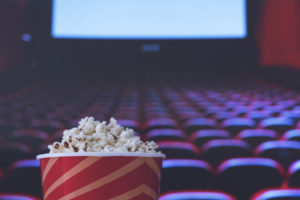 Pop corn on a red armchair in a cinema