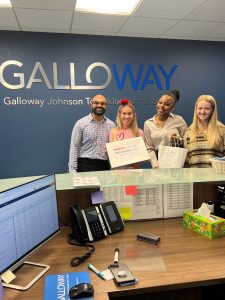 Staff at front desk of Galloway Law with Joanne Luckman of Mediationworks who brought goodies and fresh donuts as a client appreciation