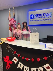 Joanne Luckman at Heritage Insurance office. Front desk delivering donuts as a client thank you. 