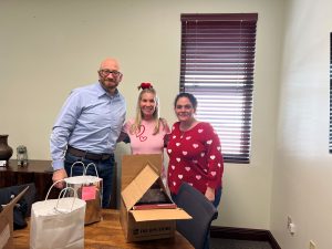 Mediationworks' Andrew Winston and Joanne Luckman delivering donuts as a thank you to clients 