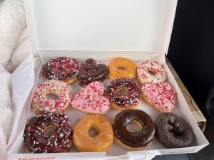 Valentine's donuts with pink, chocolate and sprinkles as thank you to clients from MediationWorks.