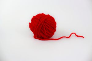 Red yarn isolated on white background