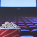 Pop corn on a red armchair in a cinema