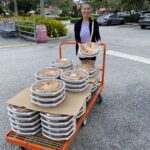 MediationWorks Joanne Luckman with a cart of more than 50 apple pies