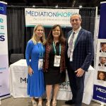 Joanne Luckman, Eric Luckman and Brenda Pagliaro at booth at 2026 Wind Conference